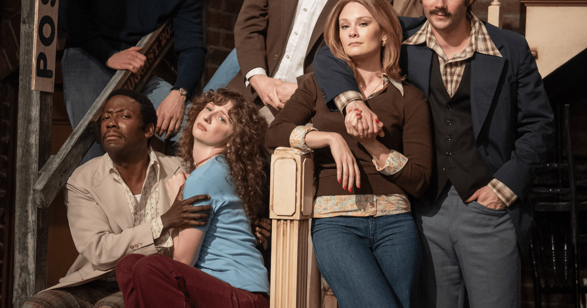 A group of actors recreates an iconic cast photo of the original cast of 'Saturday Night Live' in the movie 'Saturday Night'.